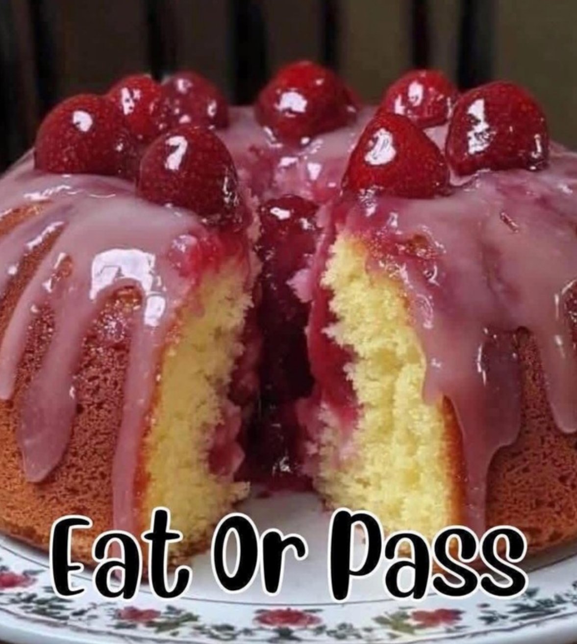 Moist strawberry cheesecake pound cake topped with strawberry glaze and fresh berries