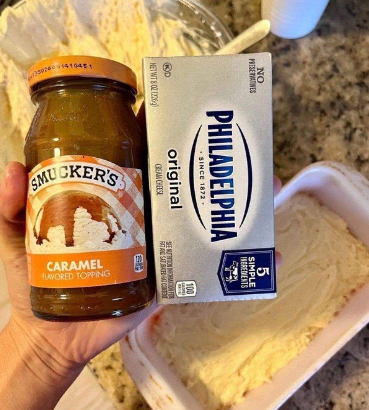 Moist caramel cream cheese bread with a caramel swirl, baked in a loaf pan and sliced for serving.