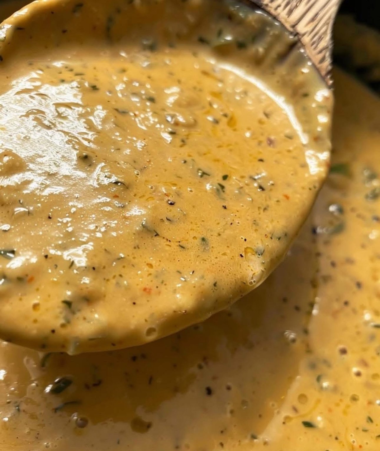 A skillet filled with creamy Cajun sauce made with butter, garlic, and spices.