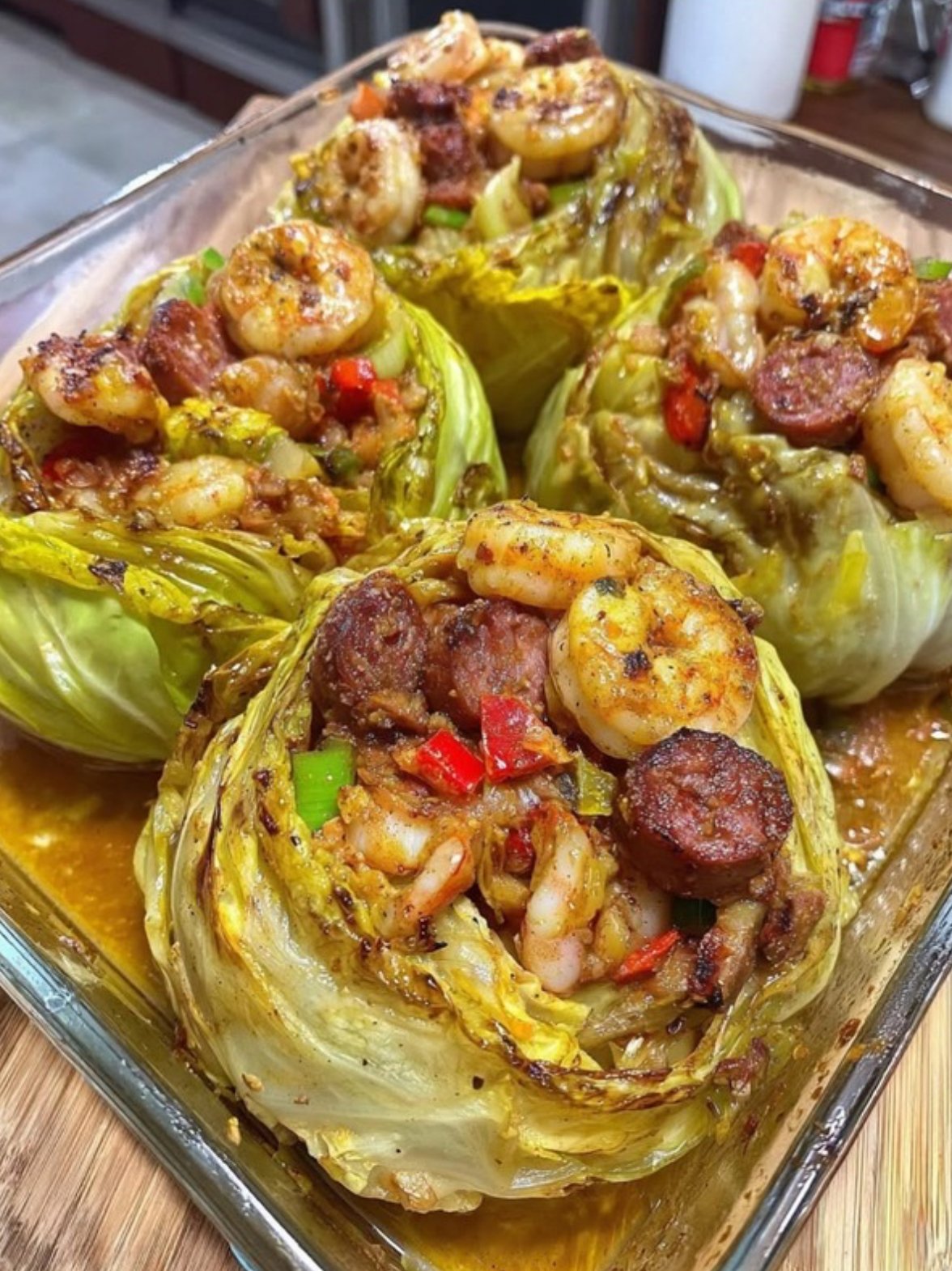 Cabbage bowl stuffed with Cajun shrimp, sausage, bell peppers, and cheese.